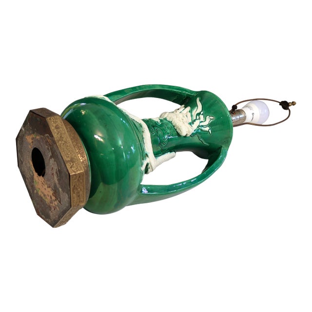 Antique Awaji pottery green and white dragon lamp, circa 1920's. The white dragon curling up the body of the lamp between...