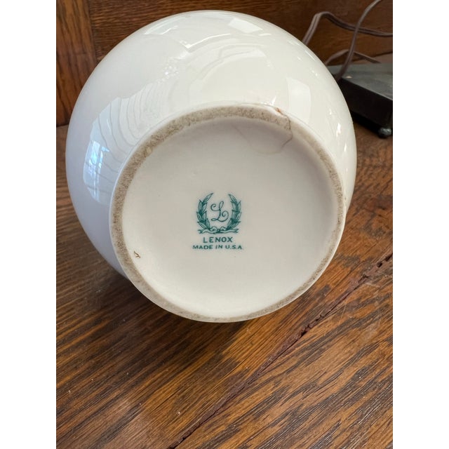 Add a touch of retro elegance to your shelving or tablescape with this striking Mid-Century Modern ceramic bulb vase....