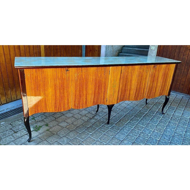 Italian dining room including a table, a enfilade, and six chairs of melchior bega the whole in good condition and being...