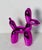 Modern sculpture of ceramic purple balloon dog.