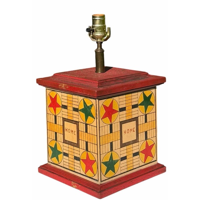 Striking vintage folk art table lamp with a square painted wood base featuring a game board-inspired design. All four...
