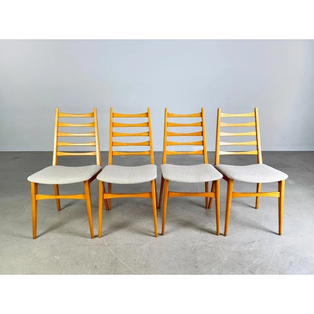 We are offering a beautiful set of four vintage chairs from the 1960s with horizontal slats in the backrest for sale. The...