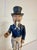 Vintage Uncle Sam mechanical bank. When button is pressed, the beard and arm come and the bag opens to drop the coin....