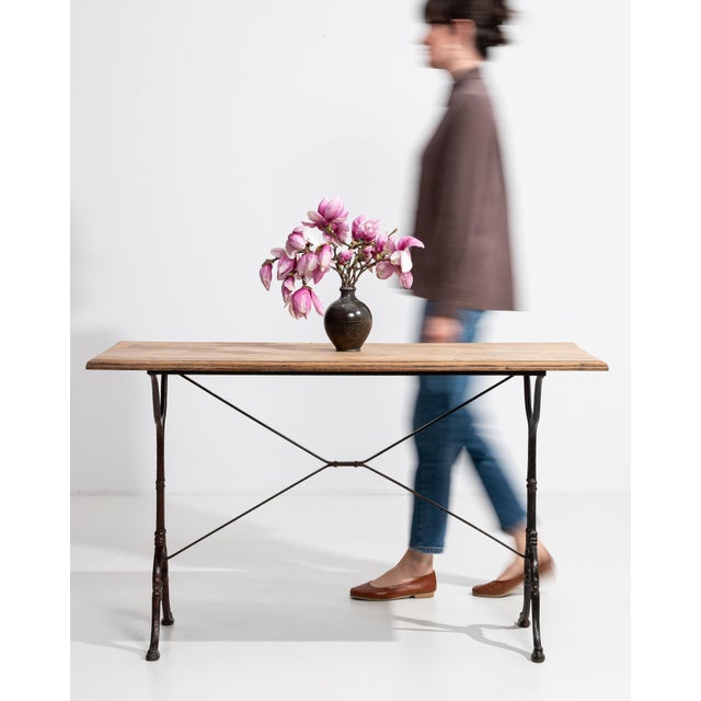 A larger variation of the classic French bistro table, offering expanded surface area while maintaining the iconic cast...