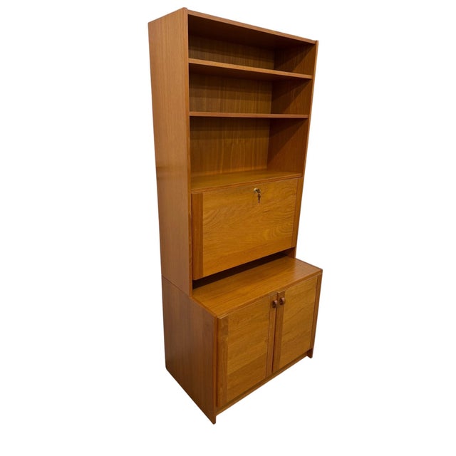 Vintage Danish Modern Domino Møbler 2-Piece Teak Bookcase, circa 1970s. A versatile Scandinavian design offering both...