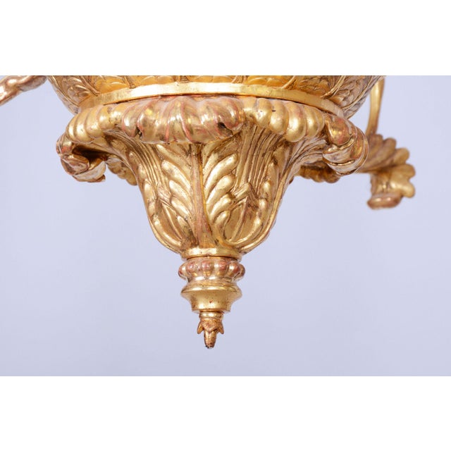 This monumental Empire chandelier is a masterpiece of Austrian craftsmanship from the early 19th century. The fixture...