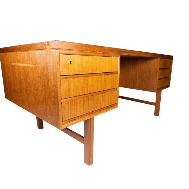 Desk in teak of Danish design from the 1960s. This piece is attributed to the mentioned designer/maker. It has no...