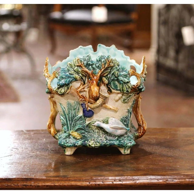 This colorful barbotine jardinière from L'Hermine a Orchies, France, was sculpted circa 1880. Almost square in shape, the...