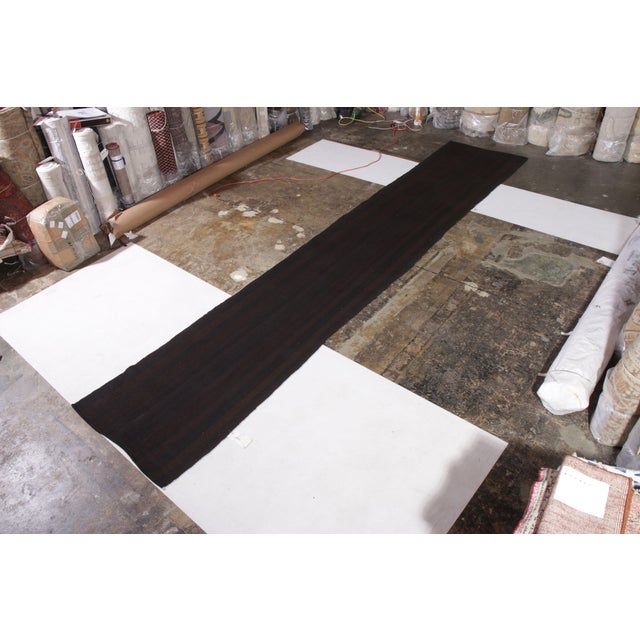 Handmade in flat woven wool originating from Persia circa 1950-1960, this vintage Persian Kilim is exceptionally rare both...