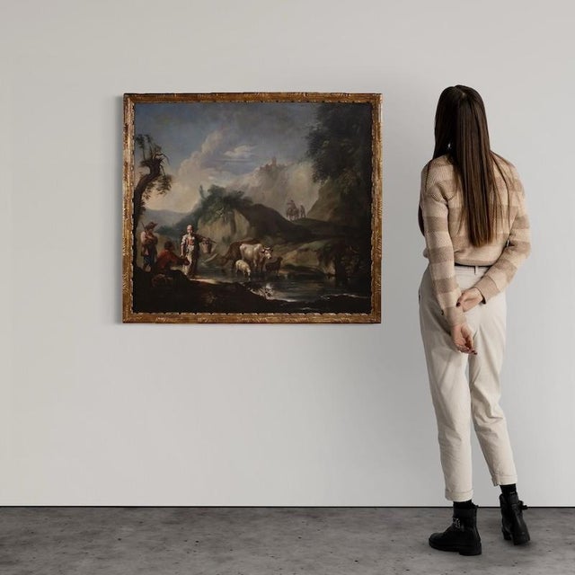 An important italian painting from the mid-18th century. Oil on canvas artwork depicting a charming landscape animated by...