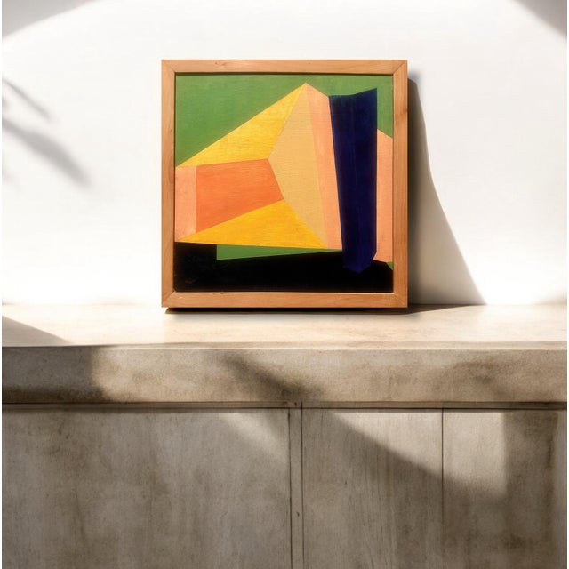 This painting features a bold geometric abstraction composed of sharp-edged, interlocking shapes and vivid colors. The...