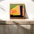 This painting features a bold geometric abstraction composed of sharp-edged, interlocking shapes and vivid colors. The...
