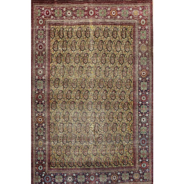 Graceful and understatedly beauty is clearly visible in this fine weave vintage Persian Tabriz area rug in an all over...