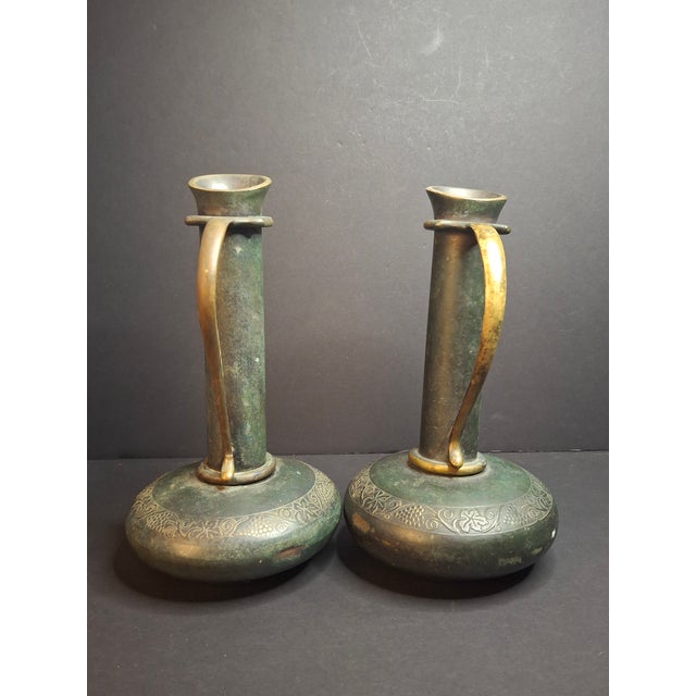 A matched pair of vintage mid-century modern cast bronze and brass decorative ewers/pitchers designed by Maurice Ascalon...