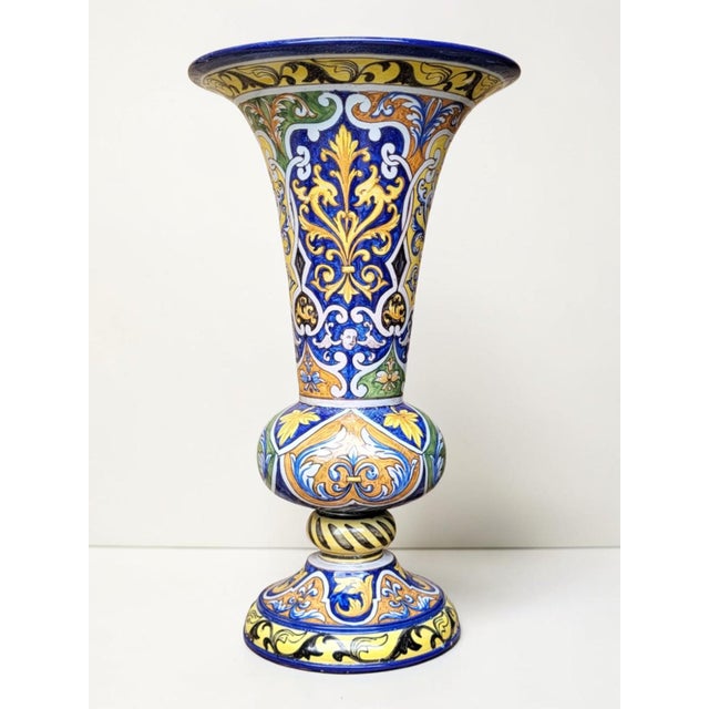 A polychrome earthenware trumpet vase from Nevers, signed by Antoine Montagnon, illustrating the great Nevers tradition of...