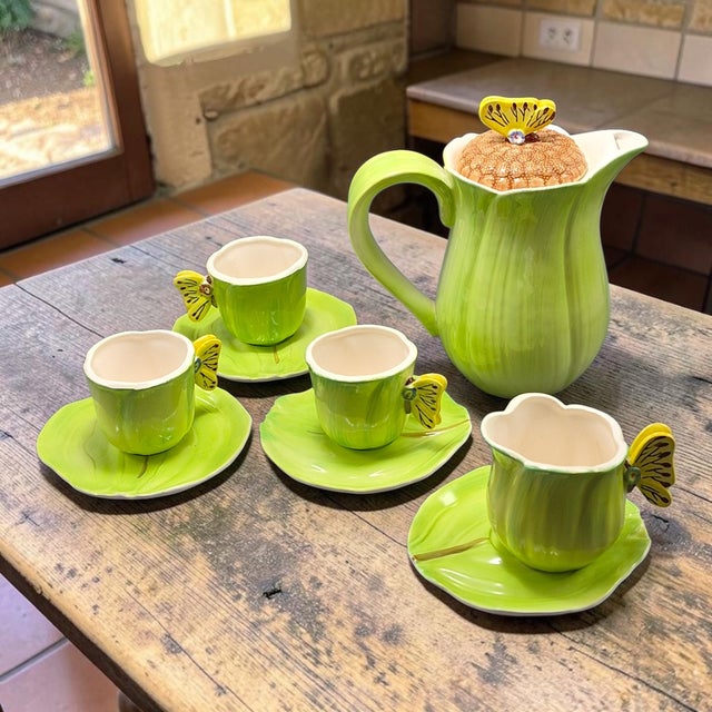 This Vintage Italian Ceramic Green Tulip Shaped Leaf Butterflies Demi Tasse Set by AMM features a charming tea set...