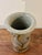 A compelling 1960s American studio ceramic vase featuring an expressive hand applied abstract motif that climbs vertically...