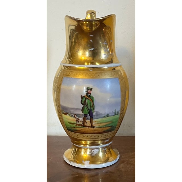 Antique early 19th century French Empire Paris porcelain ewer or jug. Decorated with a hand painted landscape scene of a...