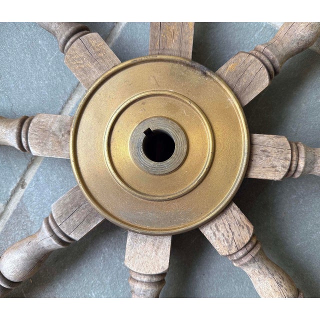 Rustic and weathered nautical eight arm wooden ships wheel with brass hub. Wheel has been previously used outdoors for...