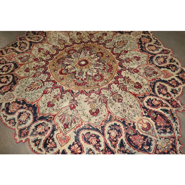 This exceptional Persian Tabriz rug features a rare and highly sought-after scalloped medallion silhouette, showcasing the...