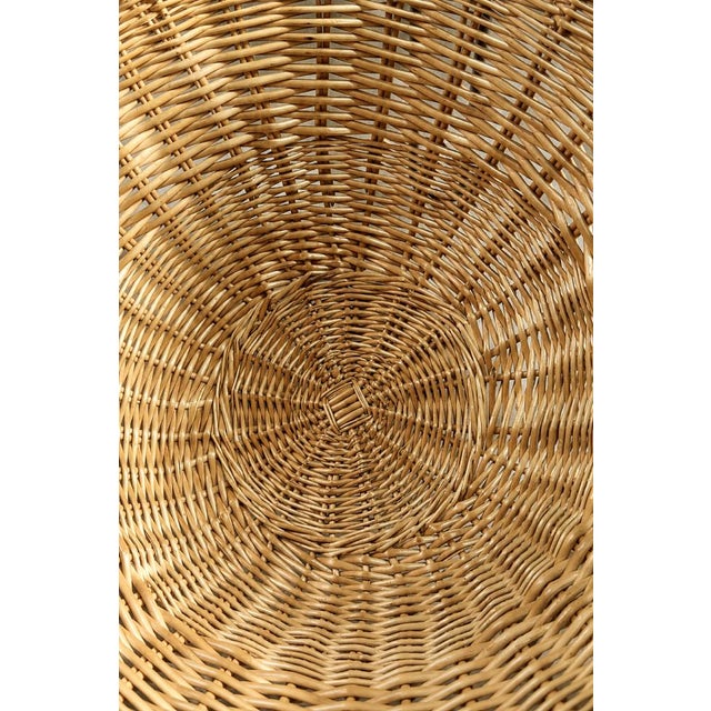 This rattan Bowl Chair was manufactured in Italy during the 1950s. Its organic, bucket-shaped shape is the quintessence of...