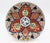 Circa 1860 pair of Imari plates, Japan. Boldly decorated rosette centers surrounded by scrolling floral tendrils, central...