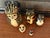 Whimsical set of late 20th century folk art nesting dolls, 5 in total. The nesting dolls are made up of 4 cats with the...