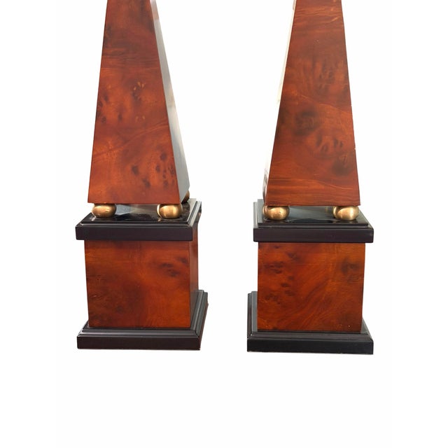 For sale is a stunning, authentic pair of Neoclassical-style decorative obelisks from the luxury home furnishings maker...