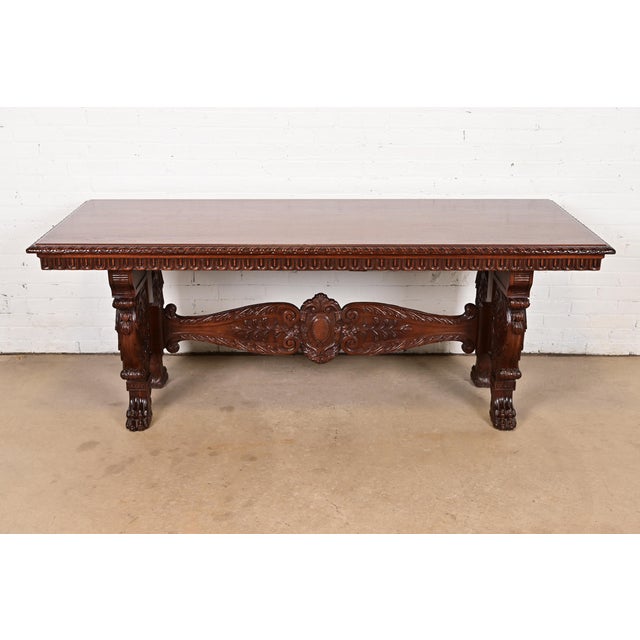 An exceptional antique Victorian or Renaissance Revival library table, writing desk, or center table In the manner of R.J....
