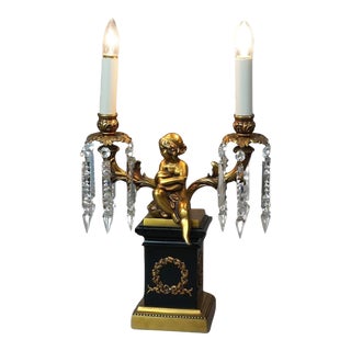 Neoclassical Cherub Figural Two-Arm Brass & Ebonized Metal Table Lamp 20th Century For Sale