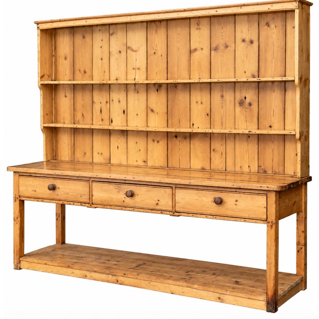 A wonderfully substantial Irish pine kitchen dresser, likely dating to the 19th century, retaining the wonderfully warm,...