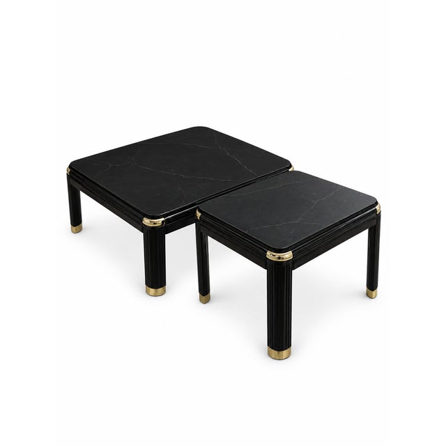 A striking vintage two-piece table set consisting of one square coffee table and one coordinating side table. Both pieces...