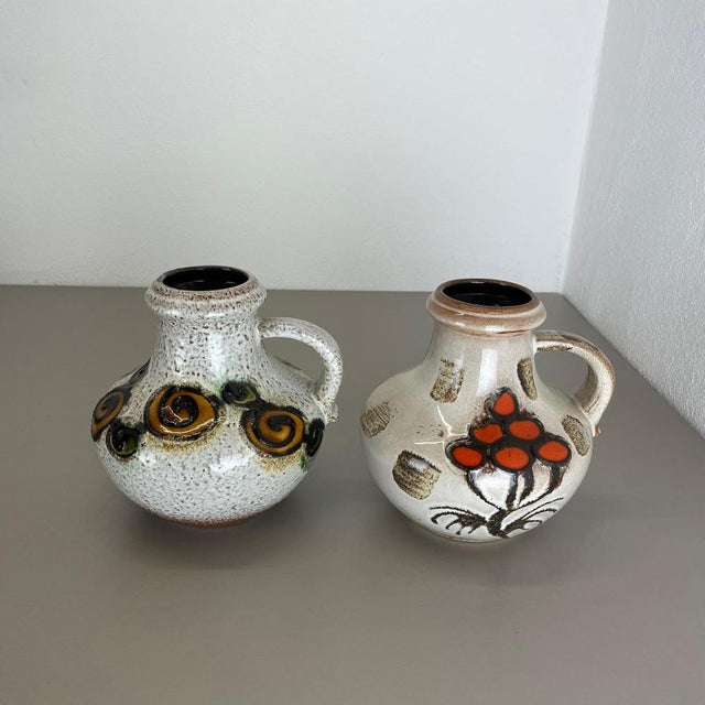 Article: Set of two fat lava art vases. Producer: Scheurich, Germany. Decade: 1970s. These original vintage vases was...