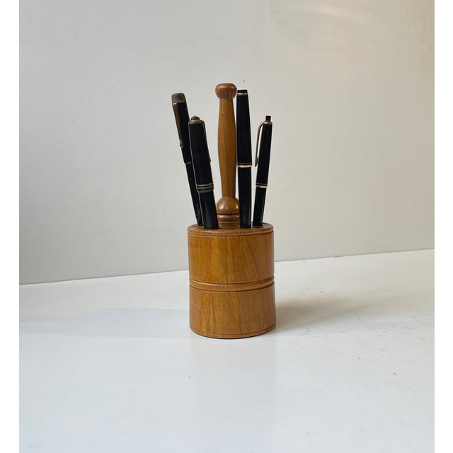 A well-made mallet shaped tool or pencil holder fashioned from solid walnut. Different-sized holes for different...