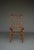 A stylish side chair made from beech wood that has been shaped to resemble bamboo. It has its original webbing seat.