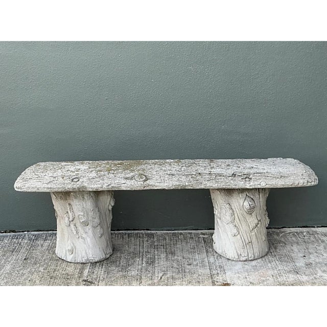 This vintage faux bois bench is cast entirely from stone to mimic the look of hewn logs, with a long, rectangular slab...