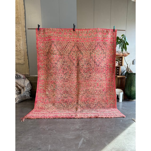 Bring a touch of authentic Moroccan craftsmanship into your home with this vintage Boujad rug, a true one-of-a-kind...