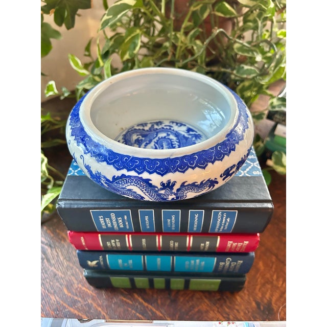 This blue and white porcelain vessel appears to be a Chinese brush washer, traditionally used in calligraphy to rinse ink...