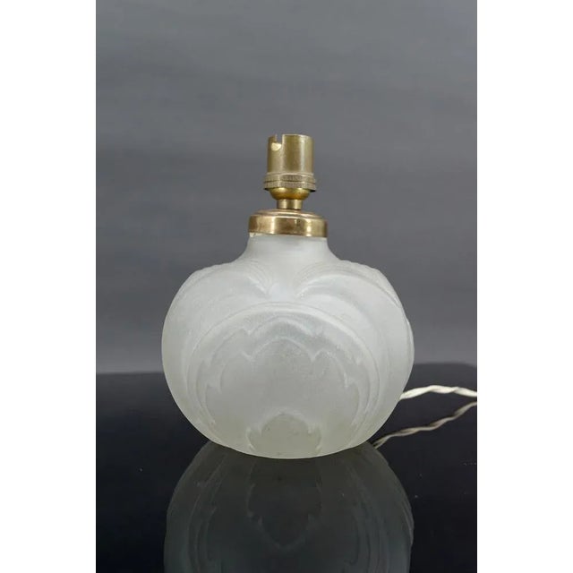 Small lamp in pressed-molded glass. Art Deco, France, circa 1925. "Made in France". Good general condition, small surface...