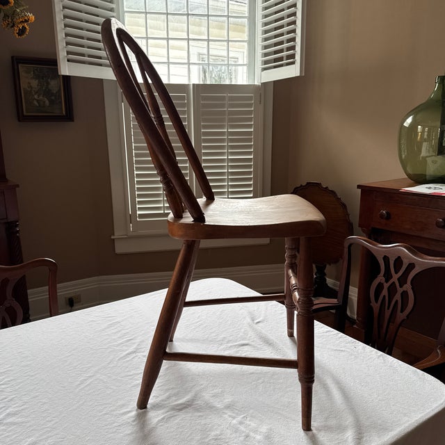 A hand-crafted chair — circa early 20th C. Farmhouse / rustic / primitive style. Windsor-style chair has bowed spindle...