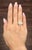 A captivating 2.36-carat GIA-certified marquise-cut diamond commands attention, showcasing a yellow hue with SI1 clarity...