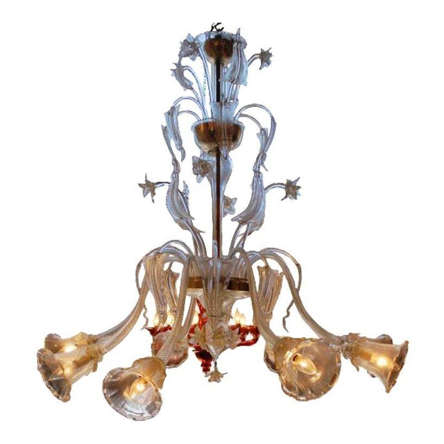 Very beautiful traditional Venetian chandelier. This 8-light piece features glass with 24K gold powder infusion. A great...