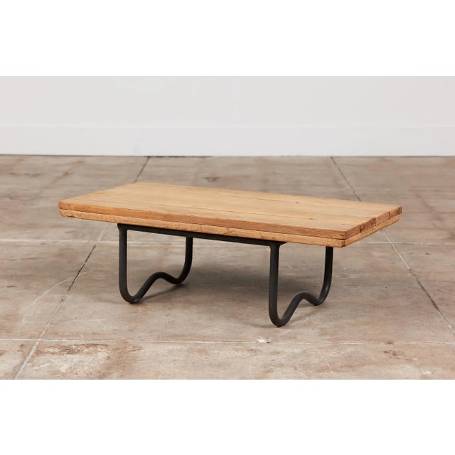 The WT-3715 Beach Table designed by Walter Lamb for Brown Jordan features a tubular bronze frame and a slatted wood...