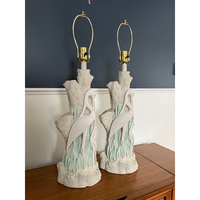 Beautiful pair of plaster Egret Lamps. Wonderful detailing with faux bois accent. 25" to top of socket