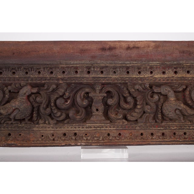 This antique Indian carved wooden panel features a decoration of yalis and mythical Annapakshi birds deeply carved into...