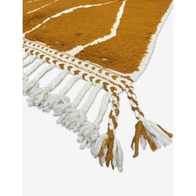 Contemporary Beni Ourain-Style Rug | Handwoven Berber Wool Rug with Copper Field and Diamond Lattice This bold...