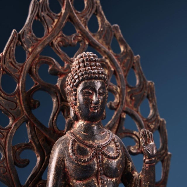 This is a traditional Chinese copper‑cast Guanyin (Avalokiteshvara) bodhisattva sculpture. The deity sits in meditation...