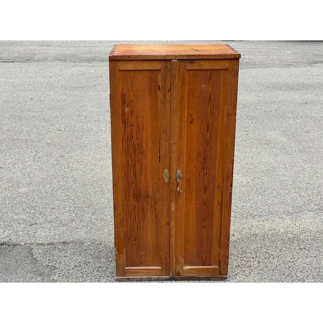 A traditional pine cupboard from the 1930s. Crafted with meticulous care and attention to detail, this cupboard features...