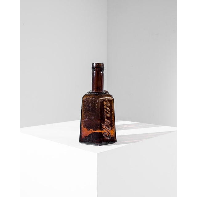 A vintage glass bottle from Europe, produced around 1900. Originally containing concentrated bouillon, the charming...