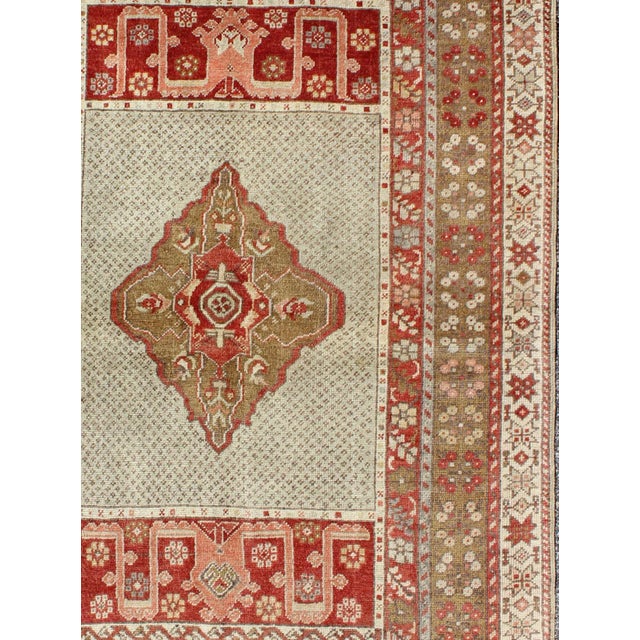 Antique Medallion Turkish Small Oushak Carpet in Various Green Tones & Red Measures: 3.6 x 5.3 Antique Turkish Oushak...